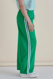 A model wearing the Nikki Relax Cotton Jogger in colour Green (Green), from the front, cropped image