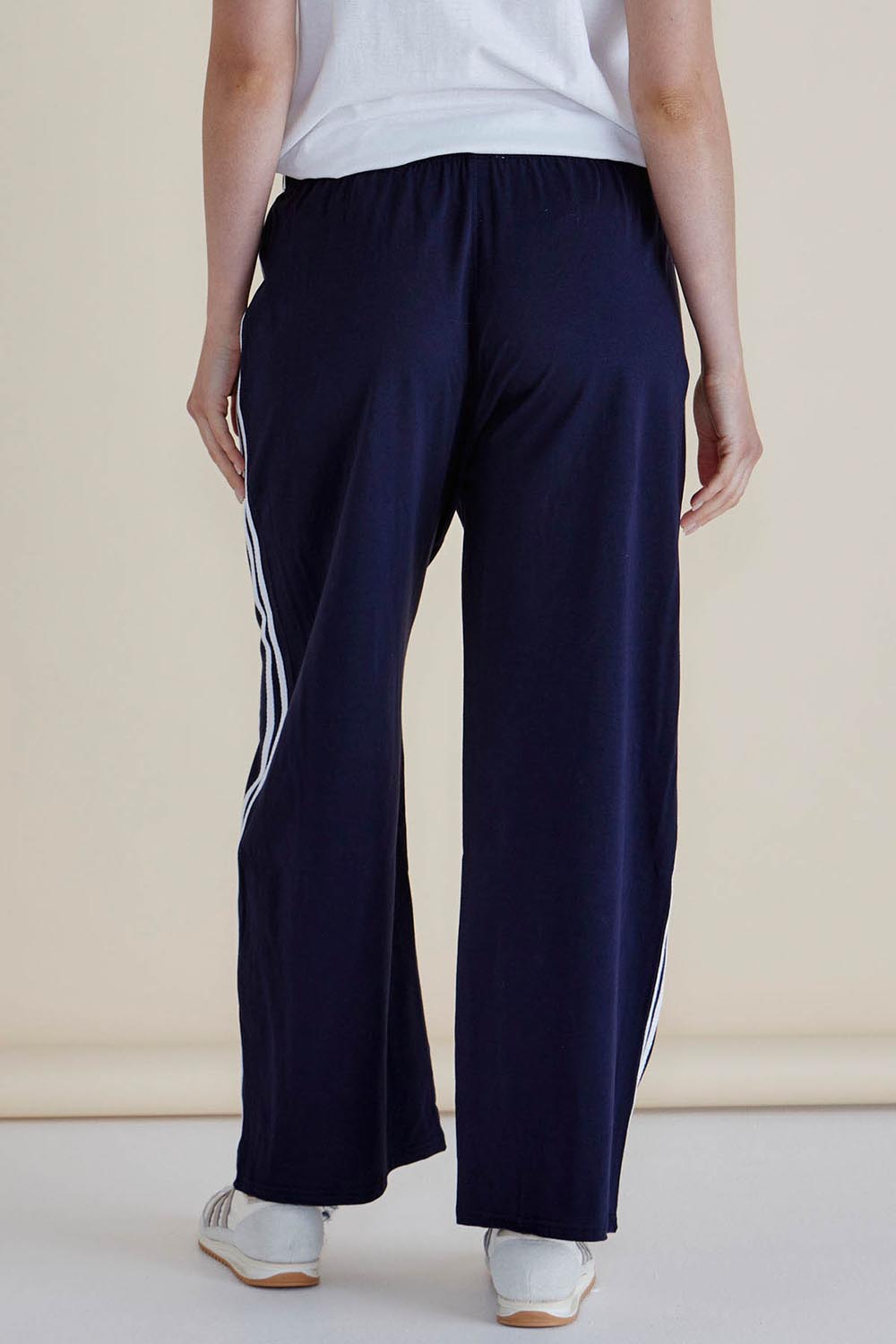 A model wearing the Nikki Relax Cotton Jogger in colour Navy (Blue), from the back