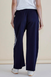A model wearing the Nikki Relax Cotton Jogger in colour Navy (Blue), from the back
