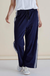 A model wearing the Nikki Relax Cotton Jogger in colour Navy (Blue), from the front, cropped image