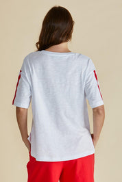 A model wearing the Relax Boxy Cotton Tee in colour Cherry (Red), from the back