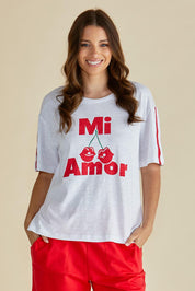 A model wearing the Relax Boxy Cotton Tee in colour Cherry (Red), from the front, cropped image
