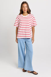 Model Genericm wearing size sample of the Relax Boxy Tee – Redwhite in colour Redwhite, from the front