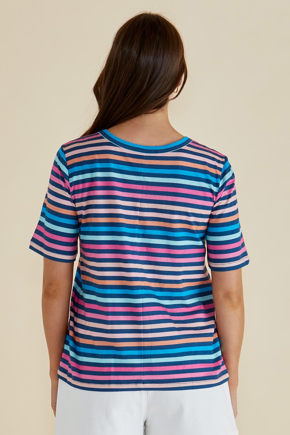 A model wearing the Riley Cotton Tee in colour Multistrip, from the back