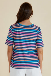 A model wearing the Riley Cotton Tee in colour Multistrip, from the back