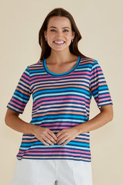 A model wearing the Riley Cotton Tee in colour Multistrip, from the front, cropped image