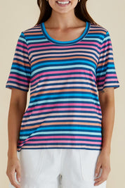 A model wearing the Riley Cotton Tee in colour Multistrip, from the front, cropped image