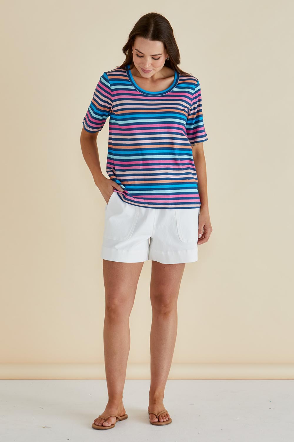 A model wearing the Riley Cotton Tee in colour Multistrip, from the front, showing the whole outfit