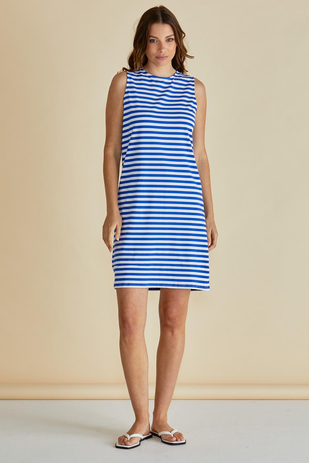 A model wearing the Tia Cotton Tank Dress in colour Royalblue (Blue), from the front, showing the whole outfit