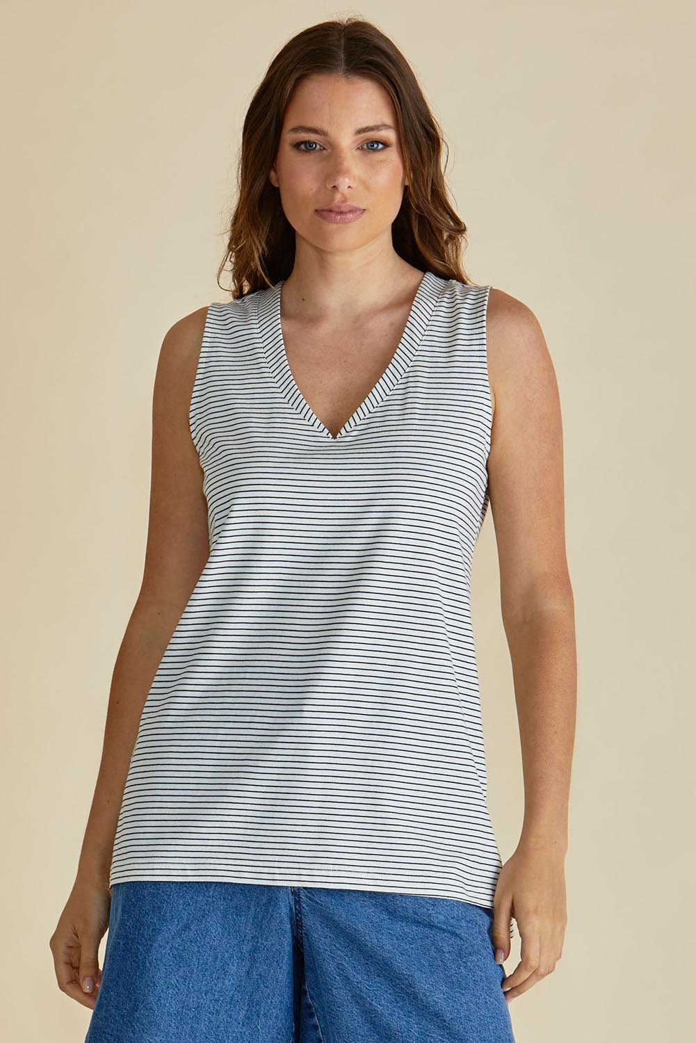 A model wearing the Trinity Vin colourNeck Cotton Tank - Blkwhite, from the front, cropped image