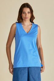 A model wearing the Trinity Vin colourNeck Cotton Tank - Powderblue (Blue), from the front, cropped image