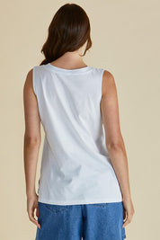 A model wearing the Trinity Vin colourNeck Cotton Tank - White (White), from the back