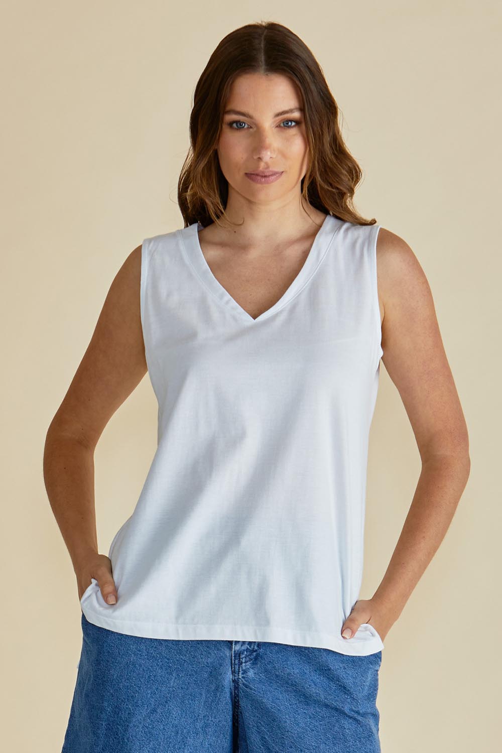A model wearing the Trinity Vin colourNeck Cotton Tank - White (White), from the front, cropped image