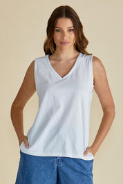A model wearing the Trinity Vin colourNeck Cotton Tank - White (White), from the front, cropped image