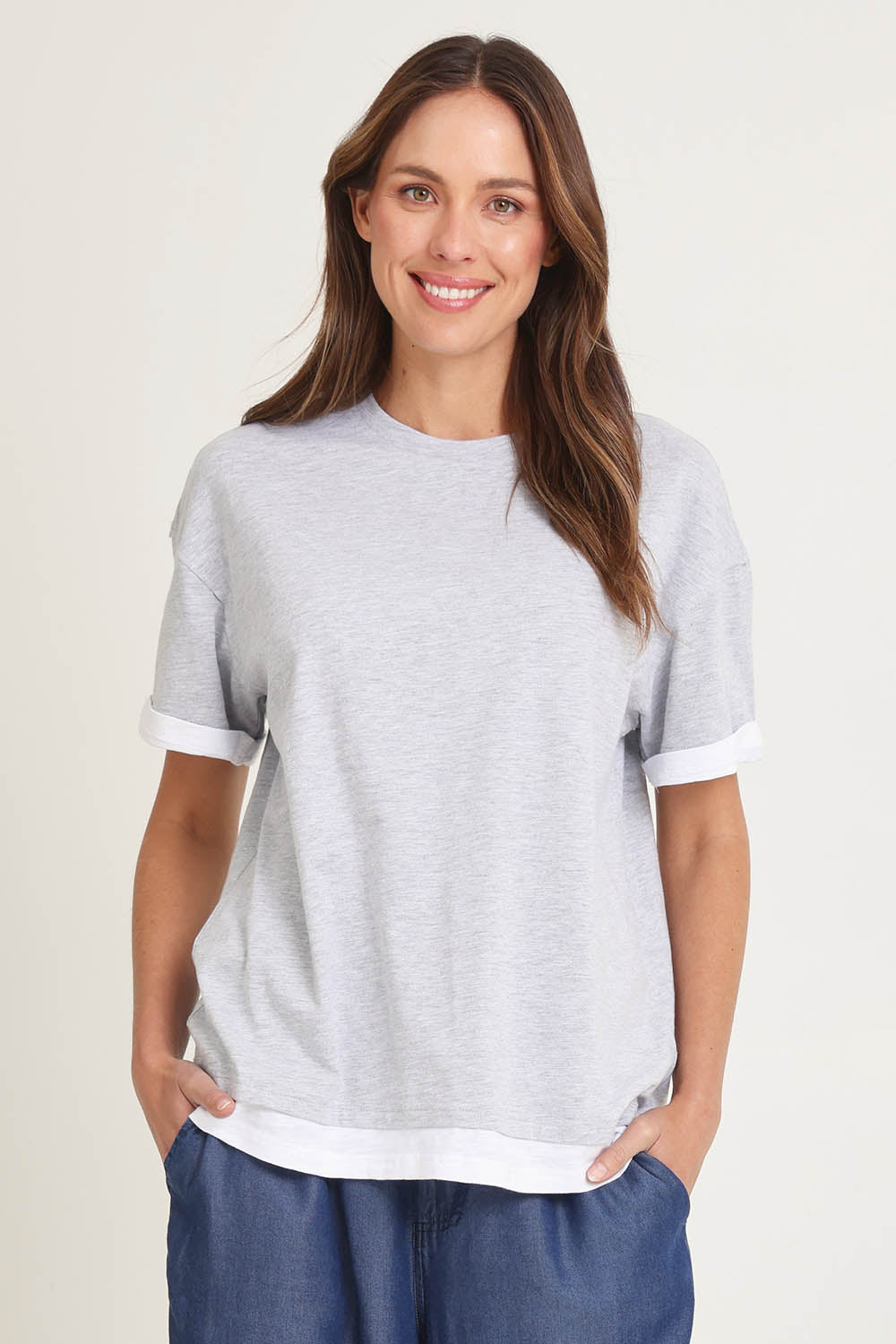 Model Madeline wearing size 10 of the Cotton Boyfriend Tee in colour Greymarle (Grey), from the front, cropped image