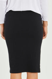 Model Katie wearing size 10 of the Alicia Midi Skirt in colour Black (Black), from the front, cropped image