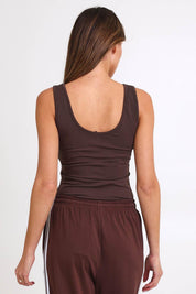 Model Madelinec wearing size 10 of the Emma Scoop Tank – Chocolate in colour Chocolate, from the back