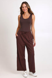 Model Madelinec wearing size 10 of the Emma Scoop Tank – Chocolate in colour Chocolate, from the front