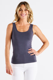 A model wearing the Emma Cotton Scoop Tank in colour Steel (Grey), from the front, cropped image