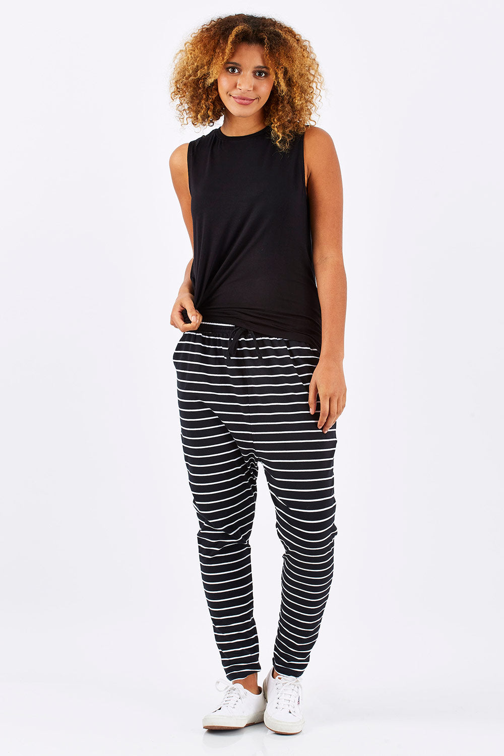 Model Summer wearing size 10 of the Jade Pant in colour BlackWhite (Black), from the front, showing the whole outfit