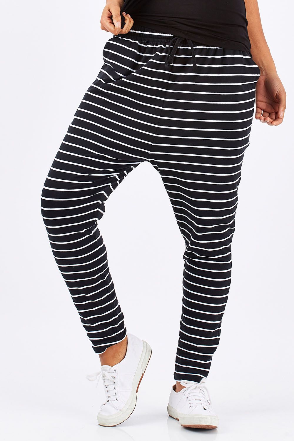 Model Summer wearing size 10 of the Jade Pant in colour BlackWhite (Black), from the front, showing the whole outfit