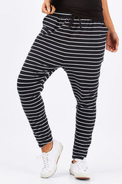 Model Summer wearing size 10 of the Jade Pant in colour BlackWhite (Black), from the front, showing the whole outfit