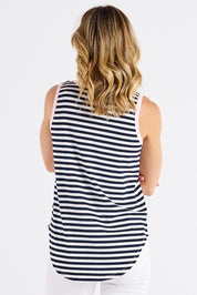 A model wearing the Keira Cotton Tank in colour Navystrpnk (Blue), from the back