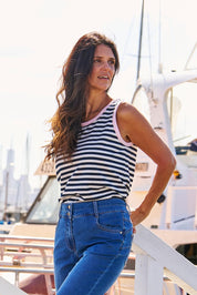 A model wearing the Keira Cotton Tank in colour Navystrpnk (Blue), from the front, showing the whole outfit