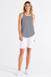 A model wearing the Keira Cotton Tank in colour Navystrpnk (Blue), from the front, showing the whole outfit