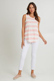 Model Madeline wearing size 10 of the Keira Tank in colour Babypink (Pink), from the front, showing the whole outfit
