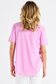 A model wearing the Ariana Cotton Tee in colour Vividberry (Pink), from the back