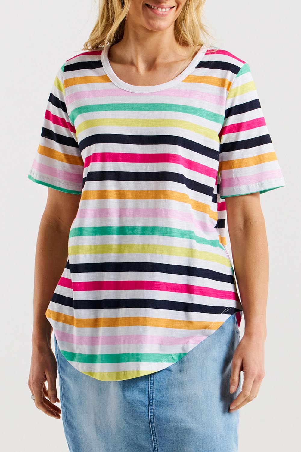 A model wearing the Ariana Cotton Tee in colour Rainbow, from the front, cropped image