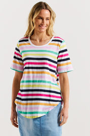 A model wearing the Ariana Cotton Tee in colour Rainbow, from the front, cropped image