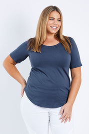 Model Fiona wearing size 16 of the Ariana Tee in colour Indiblue (Blue), from the front, cropped image