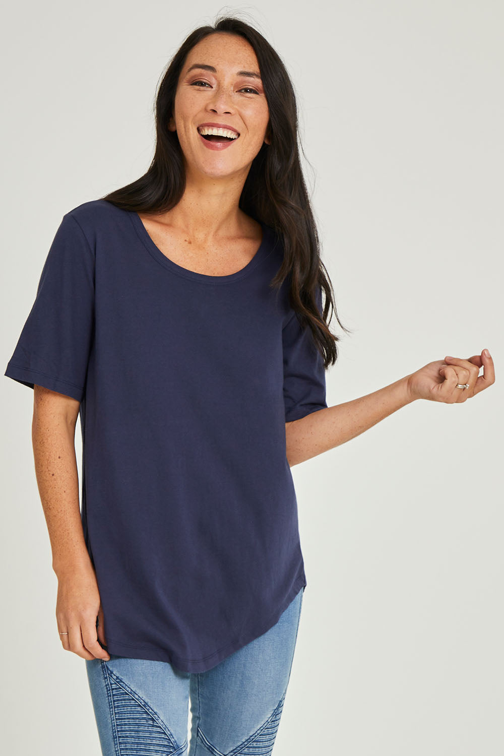 Model Katie wearing size 10 of the Ariana Tee in colour Newnavy (Blue), from the front, cropped image