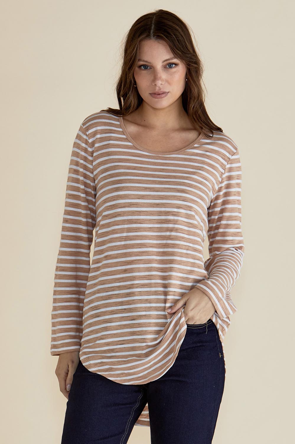 A model wearing the Megan Long Sleeve Top in colour Beigestrip, from the front, cropped image