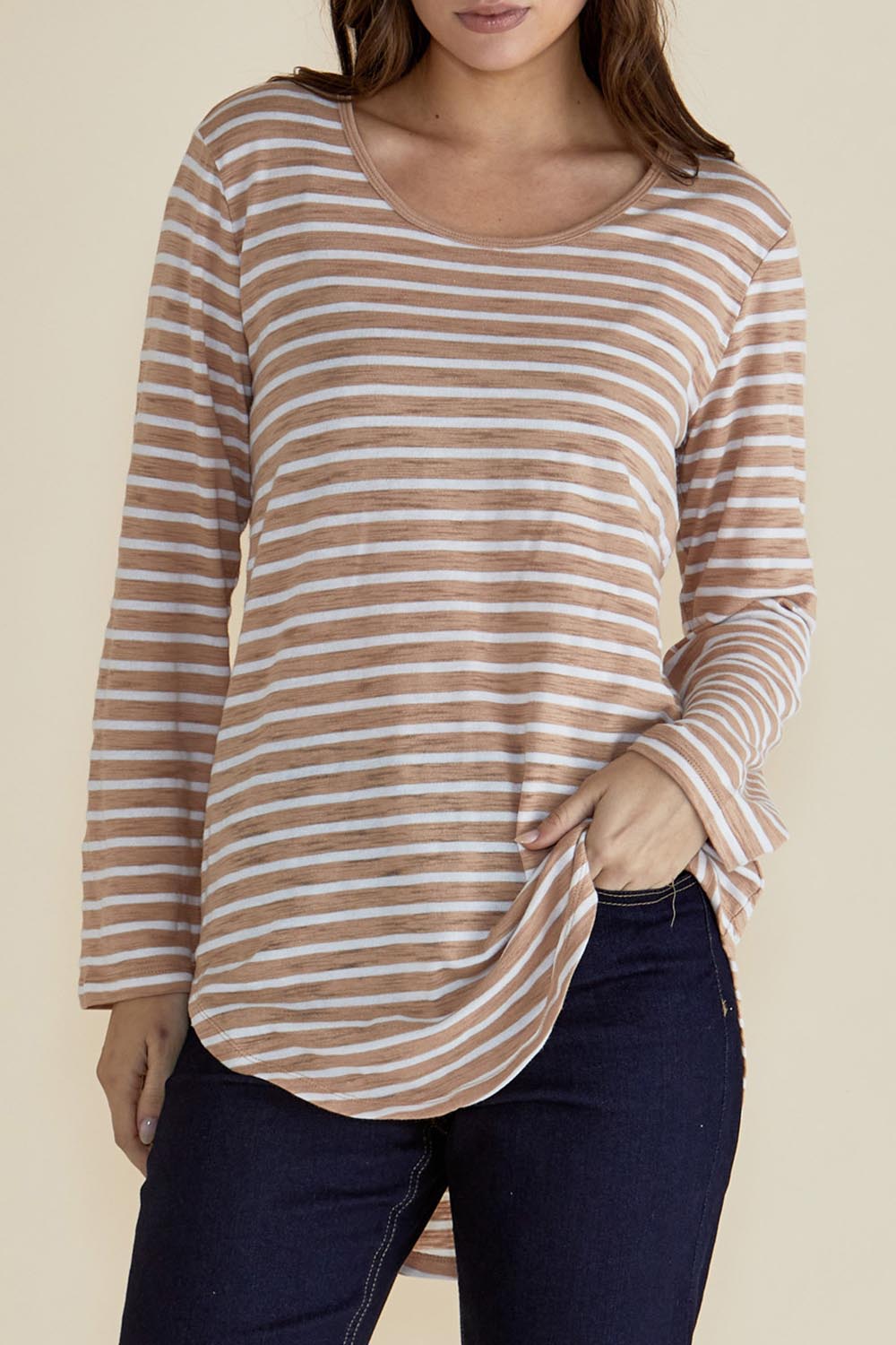 A model wearing the Megan Long Sleeve Top in colour Beigestrip, from the front, cropped image