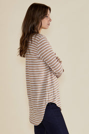 A model wearing the Megan Long Sleeve Top in colour Beigestrip, from the front, cropped image