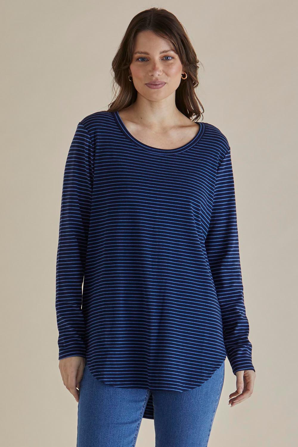 A model wearing the Megan Long Sleeve Top in colour Bluestripe (Blue), from the front, cropped image