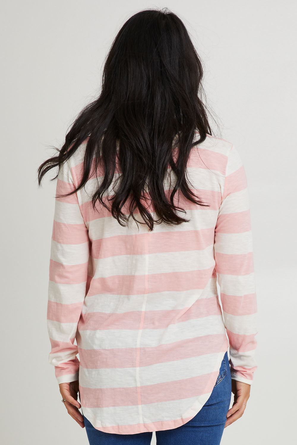 Model Katie wearing size 10 of the Megan Long Sleeve Top in colour Babypink (Pink), from the back