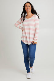 Model Katie wearing size 10 of the Megan Long Sleeve Top in colour Babypink (Pink), from the front, showing the whole outfit