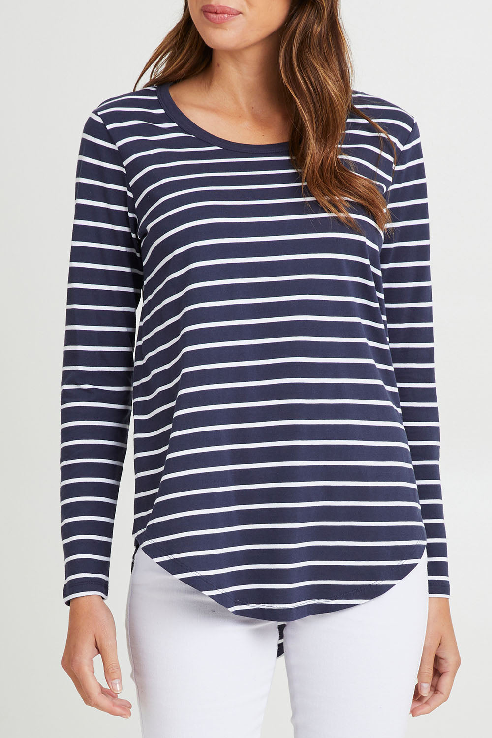Model Madeline wearing size 10 of the Megan Long Sleeve Top in colour Bluestrp (Blue), from the front, cropped image