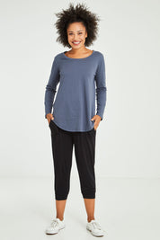 Model Olivia wearing size 10 of the Megan Long Sleeve Top in colour Indiblue (Blue), from the front, showing the whole outfit