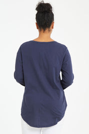 Model Noli wearing size 14 of the Megan Long Sleeve Top in colour Newnavy (Blue), from the back