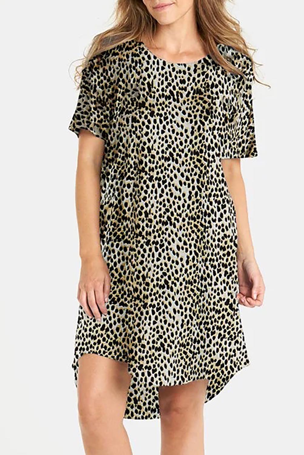 A model wearing the Nyree Cotton Dress in colour Leopard, from the front, cropped image