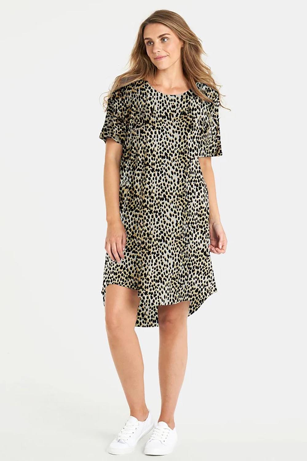 A model wearing the Nyree Cotton Dress in colour Leopard, from the front, showing the whole outfit