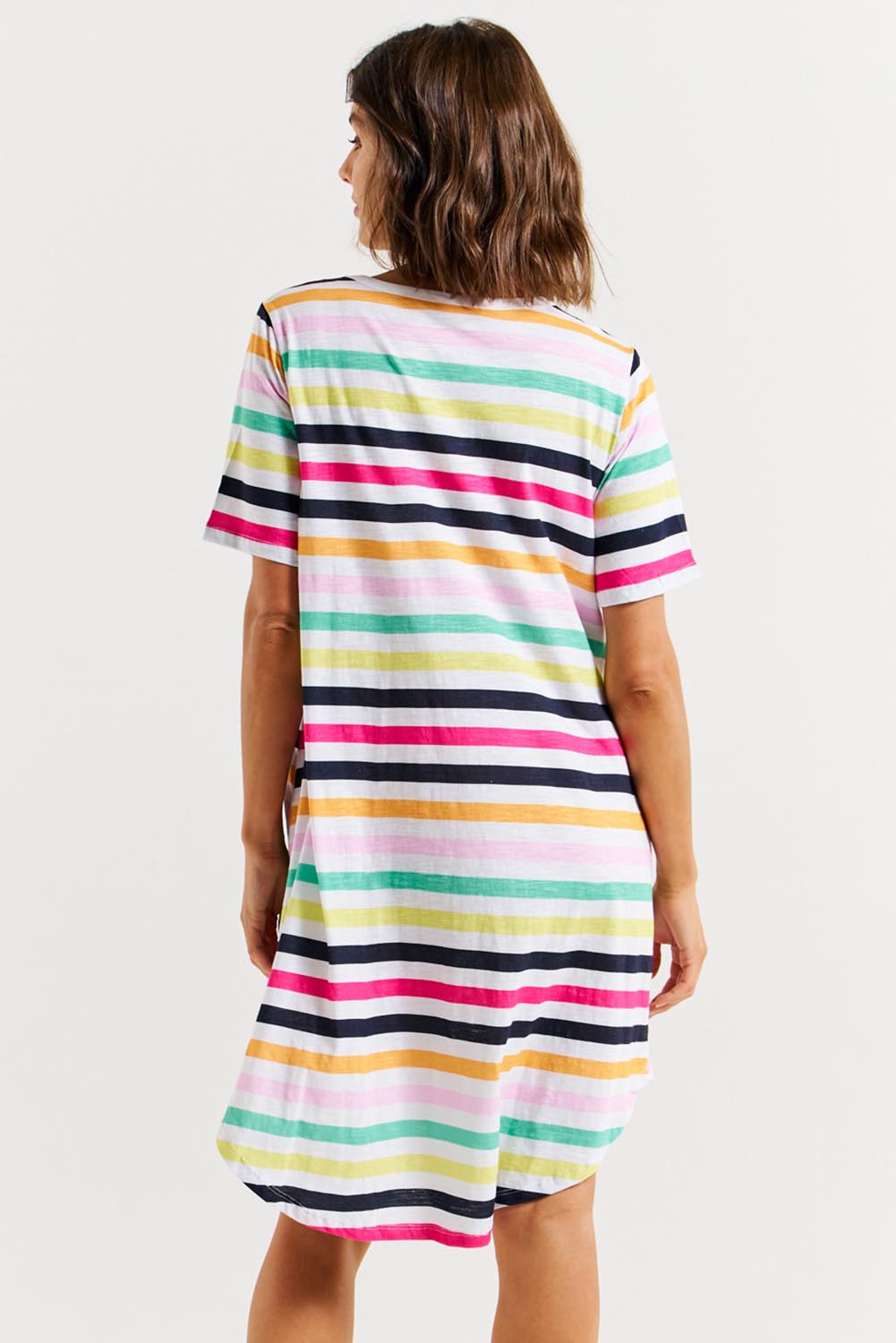 A model wearing the Nyree Cotton Dress in colour Rainbowstr, from the back