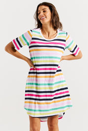 A model wearing the Nyree Cotton Dress in colour Rainbowstr, from the front, cropped image