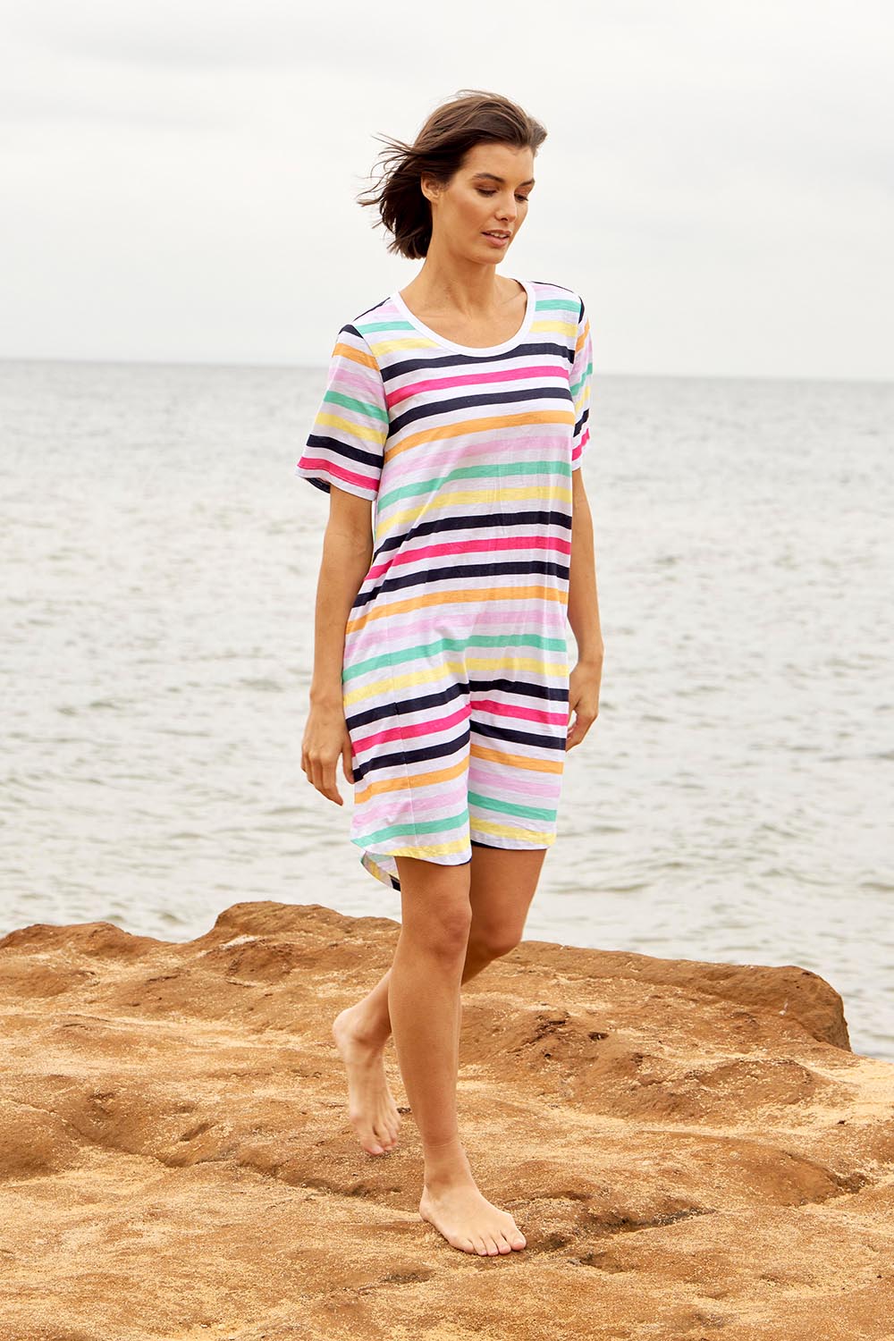 A model wearing the Nyree Cotton Dress in colour Rainbowstr, from the front, showing the whole outfit