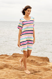 A model wearing the Nyree Cotton Dress in colour Rainbowstr, from the front, showing the whole outfit